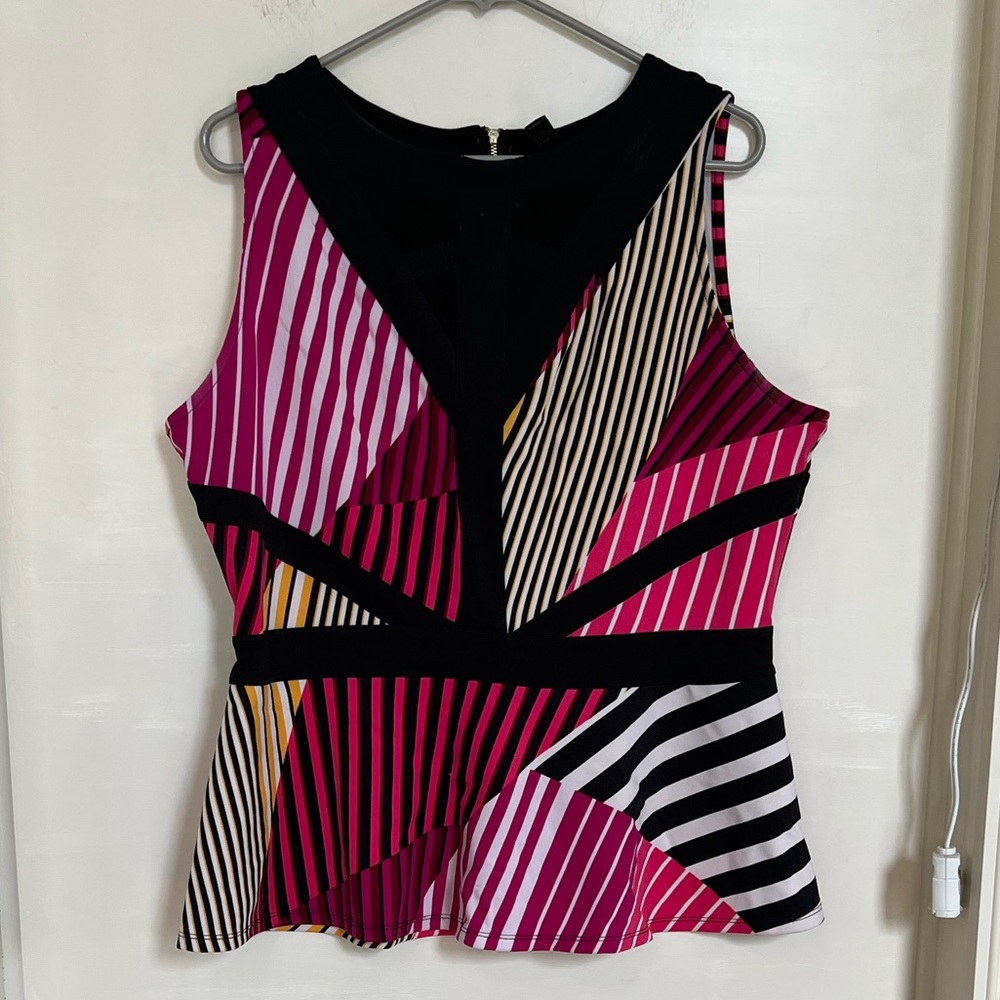 Paneled, peplum, sleeveless blouse